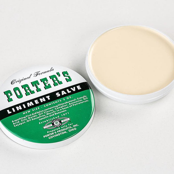 Handcrafted Porter's liniment salve in a round white and green tin, soothing first-aid remedy made in USA, featured in Health & Wellness, Balms, Creams and Lotions collections.