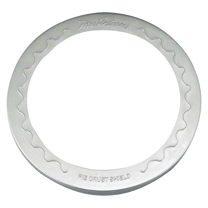 Aluminum pie crust shield with scalloped edges, designed to fit 10-inch pies and protect crusts from burning during baking, ideal for kitchen gadgets and baking supplies collections.