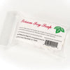 Clear wrapped handmade soap bar labeled for preventing and soothing poison ivy rash, featuring natural ingredients and made in the USA, ideal for health and wellness collections.