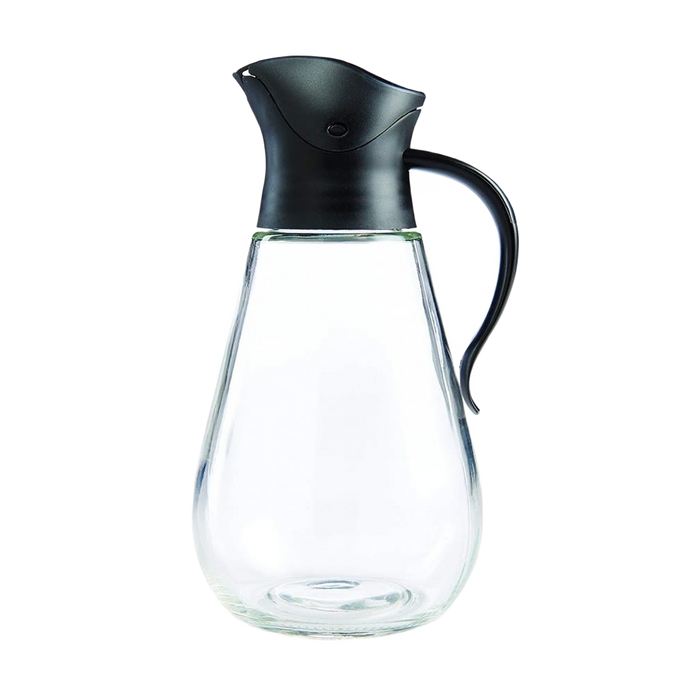 Clear glass syrup dispenser with ergonomic handle and gravity-style black lid that closes automatically when upright, ideal for Kitchen & Food, Storage and Serving, and Best Sellers collections.