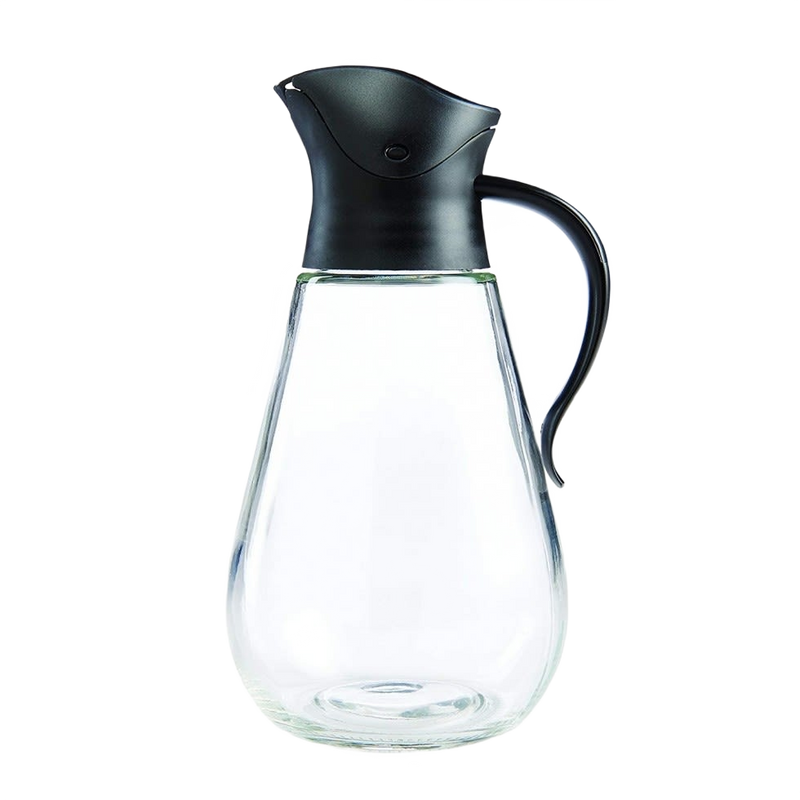 Clear glass syrup dispenser with ergonomic handle and gravity-style black lid that closes automatically when upright, ideal for Kitchen & Food, Storage and Serving, and Best Sellers collections.