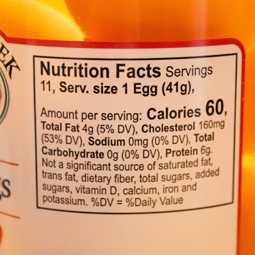 Close-up of nutrition facts label on a glass jar showing serving size of one egg, 60 calories, 4 grams total fat, 160 milligrams cholesterol, zero sodium and carbohydrates, and 6 grams protein per serving, from a handcrafted USA made pantry product featured in Kitchen & Food, Food, Pantry, USA Made, Best Sellers, and Promo Eligible collections.