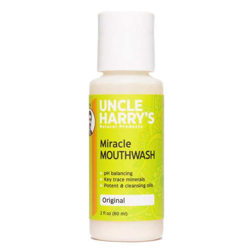 Small white plastic bottle of natural mouthwash with a bright yellow and green label featuring pH balancing and mineral benefits, suitable for Health & Wellness and Grooming collections.