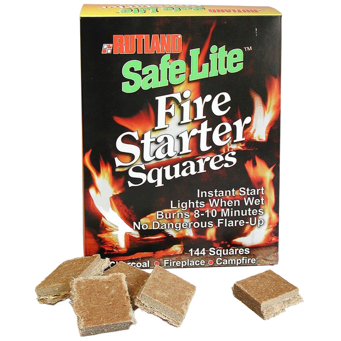 Box of handcrafted fire starter squares labeled for easy ignition, wet use, and long burn time, shown with individual squares scattered in front, ideal for stoves, hearth accessories, and outdoor fire use.