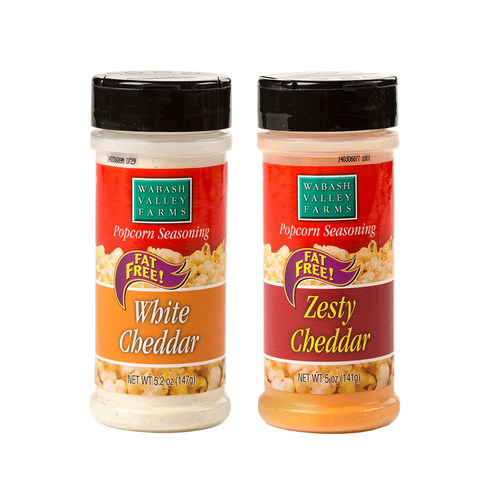 Two bottles of cheesy popcorn seasonings in white cheddar and zesty cheddar flavors, fat-free and made in the USA, perfect for Kitchen & Food, Food, and Popcorn collections.