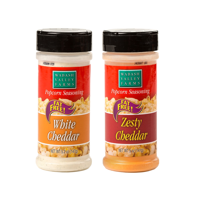 Two bottles of cheesy popcorn seasonings in white cheddar and zesty cheddar flavors, fat-free and made in the USA, perfect for Kitchen & Food, Food, and Popcorn collections.