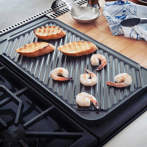 Reversible two-burner indoor grill with ribbed nonstick surface grilling shrimp and bread, featured in Kitchen & Food, Cookware, Pots and Pans, USA Made, Best Sellers collections.