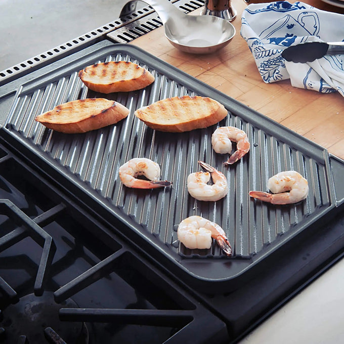 Reversible two-burner indoor grill with ribbed nonstick surface grilling shrimp and bread, featured in Kitchen & Food, Cookware, Pots and Pans, USA Made, Best Sellers collections.