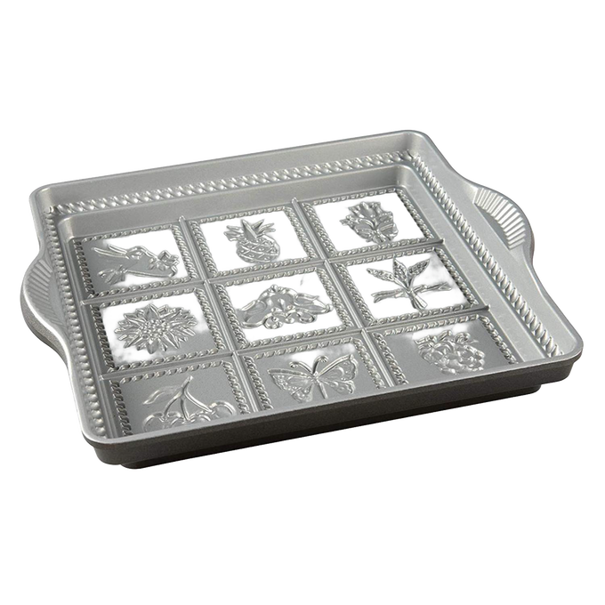 Cast aluminum baking pan with deep, detailed molds featuring floral, butterfly, and fruit designs, nonstick surface, handcrafted in USA for Kitchen & Food and Baking Supplies collections.
