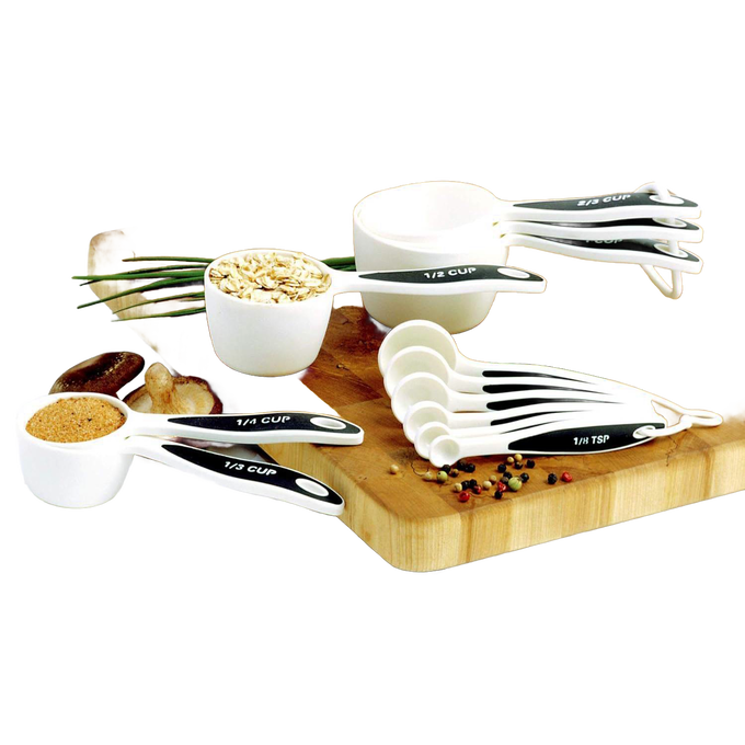 Set of 12 white measuring cups and spoons with black non-slip ergonomic handles, arranged on a wooden cutting board with spices, perfect for Kitchen & Food, Baking Supplies, and Food Prep collections.