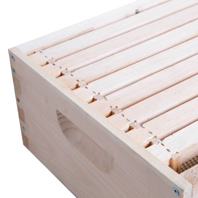 Close-up view of a handcrafted wooden 8-frame medium bee box, showcasing its smooth natural finish and assembled design, made in the USA by an Amish family, ideal for beekeeping supplies and farm tool collections.