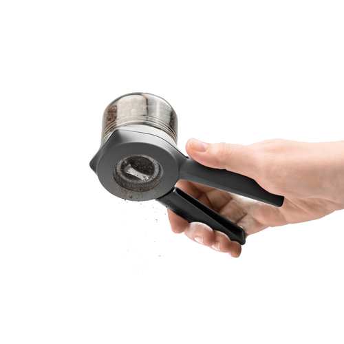 Hand holding a black and clear adjustable spice mill grinding fresh peppercorns, designed for easy one- or two-handed use, featured in Kitchen & Food, Dinnerware, and Kitchen Gadgets collections.