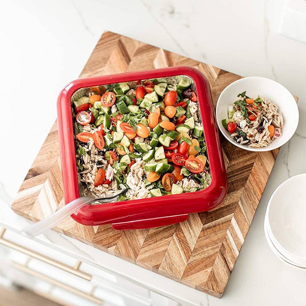 Red travel cover designed for 8x8 foil pans protecting a fresh vegetable and rice salad, shown on a wood-patterned serving board in Kitchen & Food, Kitchen Accessories, USA Made collections.