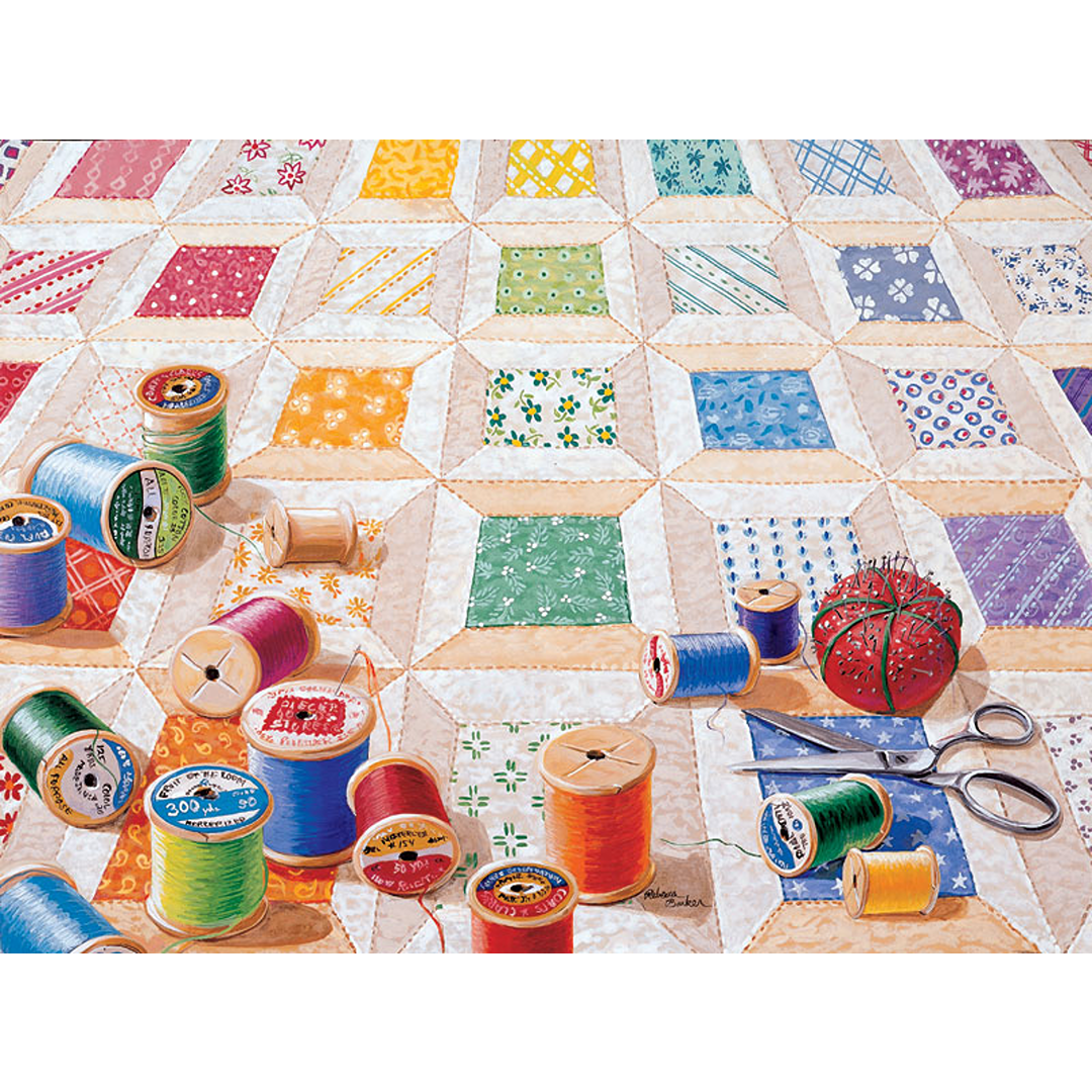 Colorful spools of thread scattered on a hand-sewn quilt pattern with sewing accessories, depicting a unique handcrafted design made in USA, featured in Toys, Books & Games and USA Made collections.