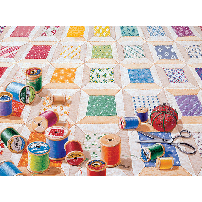 Colorful spools of thread scattered on a hand-sewn quilt pattern with sewing accessories, depicting a unique handcrafted design made in USA, featured in Toys, Books & Games and USA Made collections.