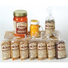Selection of handmade Amish crafted popcorn varieties in clear bags with labeled retro packaging, accompanied by a jar of natural canola oil and yellow seasoning, perfect for Kitchen & Food, Snacks and Sweets, USA Made, Amish Made, and Best Sellers collections.