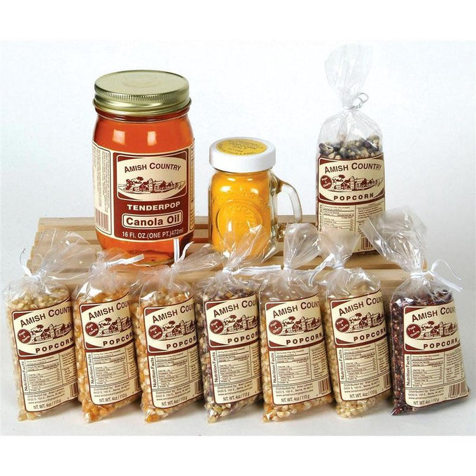 Selection of handmade Amish crafted popcorn varieties in clear bags with labeled retro packaging, accompanied by a jar of natural canola oil and yellow seasoning, perfect for Kitchen & Food, Snacks and Sweets, USA Made, Amish Made, and Best Sellers collections.