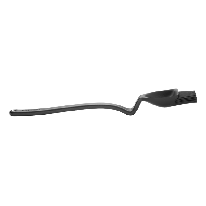 Flexible black basting brush with a deep scooping head and ergonomic handle, designed for grilling and cooking, ideal for Kitchen Gadgets and Grilling collections.