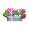 Galvanized metal basin planter with wooden-grip handles, filled with vibrant pink, purple, and white flowers, featured in Farm, Garden & Tool and Garden Accessories collections.