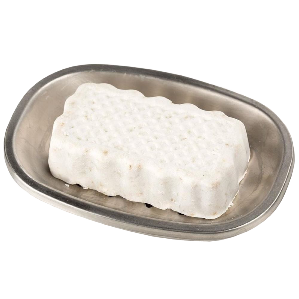 Handcrafted white jewelweed soap bar with a textured surface, resting on a simple metal soap dish, featured in Health & Wellness and USA Made collections.