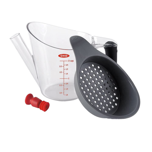 Clear plastic fat separator with gray soft-grip handle and built-in strainer, featuring red stopper and measurement markings, perfect for Kitchen & Food, Cooking Helpers, and Best Sellers collections.