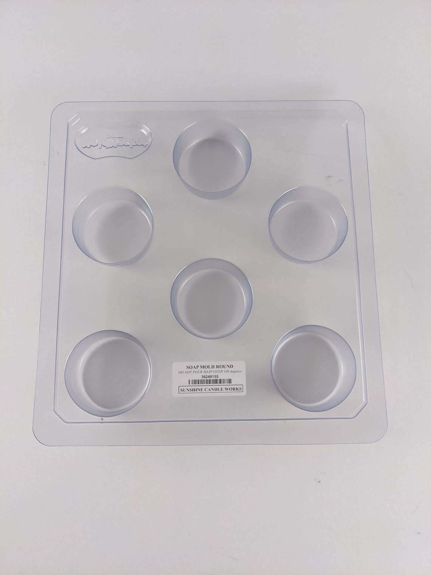 Clear plastic soap mold with six round cavities for crafting 2.5 oz bars, made in the USA, suitable for soapmaking supplies in Health & Wellness and Soaps collections.