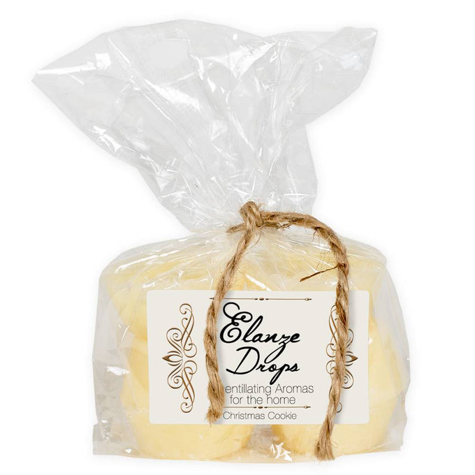 Clear plastic bag tied with rustic twine holding six pale yellow wax drops scented with Christmas Cookie, styled for Home & Decor, Best Sellers, Promo Eligible, and Sale collections.