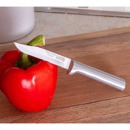 Handcrafted serrated paring knife with a finely serrated high carbon surgical stainless steel blade and solid aluminum handle piercing a red bell pepper on a wooden cutting board, made in USA, ideal for Farm, Garden & Tool, Kitchen & Food, and Knives & Axes collections.