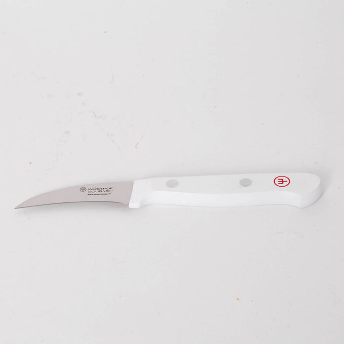Curved paring knife with a stainless steel blade and ergonomic white handle featuring rivet accents, designed for detailed food prep in Kitchen & Food and Food Prep collections.