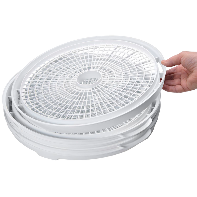 Stack of white nesting trays designed for a compact electric food dehydrator, shown being handled gently, ideal for Kitchen & Food, Food Preservation, Drying, and Best Sellers collections.