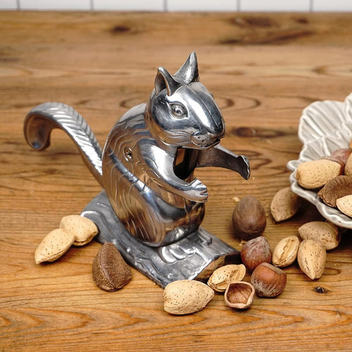Handcrafted cast aluminum nutcracker shaped like a playful squirrel, designed for cracking pecans, almonds, and walnuts, ideal for Kitchen & Food, Food Prep, Choppers and Cutters, Best Sellers, and Promo Eligible collections.