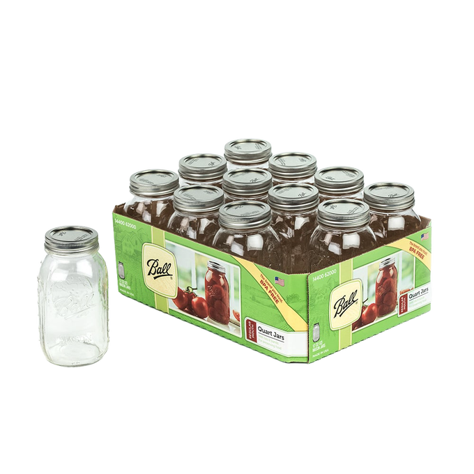 Set of twelve clear quart glass canning jars with metal screw-on lids in a green Box labeled for food preservation, accompanied by a single jar standing separately, ideal for Kitchen & Food and Canning collections.