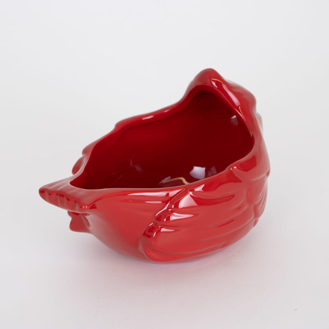Glossy red ceramic bowl shaped like a cardinal bird with handcrafted details, perfect for festive holiday decor and cozy kitchen use in Home & Decor and Dinnerware collections.