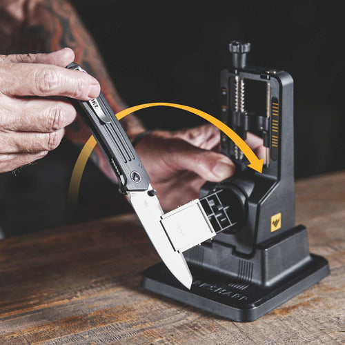 Hand adjusting a folding knife blade into a precision angle sharpening system with adjustable settings, ideal for use in Farm, Garden & Tool, Kitchen & Food, and Sharpening collections.