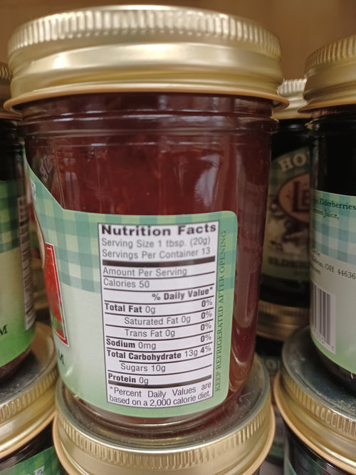 Close-up of a handcrafted jar of Amish-made jam with nutrition facts label, featuring all-natural ingredients, made in USA, ideal for Kitchen & Food, Pantry, and Best Sellers collections.