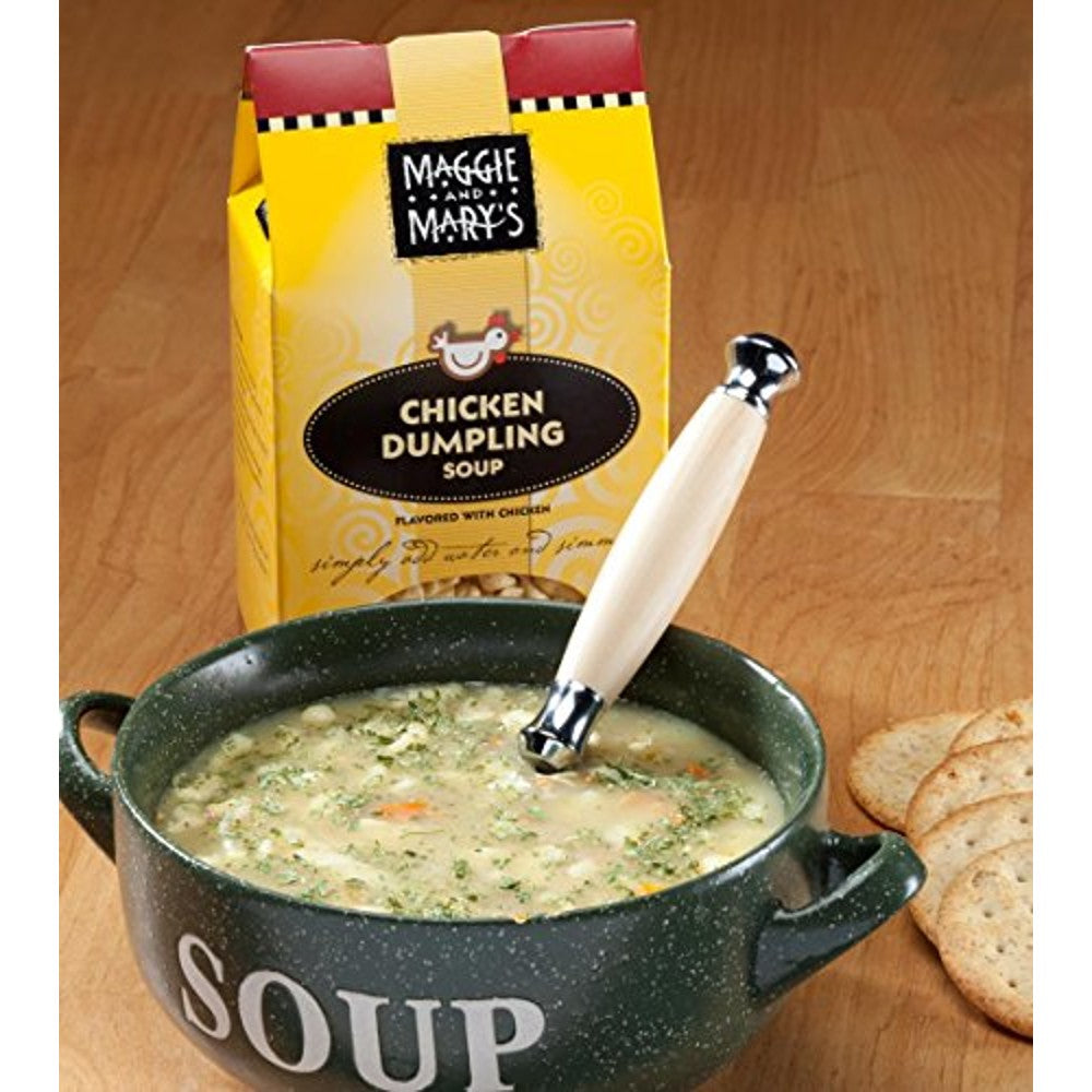 Green speckled soup bowl labeled "SOUP" filled with chicken dumpling soup garnished with herbs, next to round crackers and a yellow packet of Maggie and Mary's Chicken Dumpling soup mix, suitable for Kitchen & Food, Dry Goods and Mixes, Soups, USA Made, Best Sellers, and Promo Eligible collections.