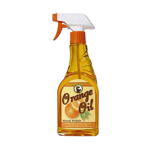 Clear spray bottle of handcrafted orange oil wood polish made in USA, conditioning and enhancing wood surfaces with a natural glow, ideal for home decor and cleaning collections.