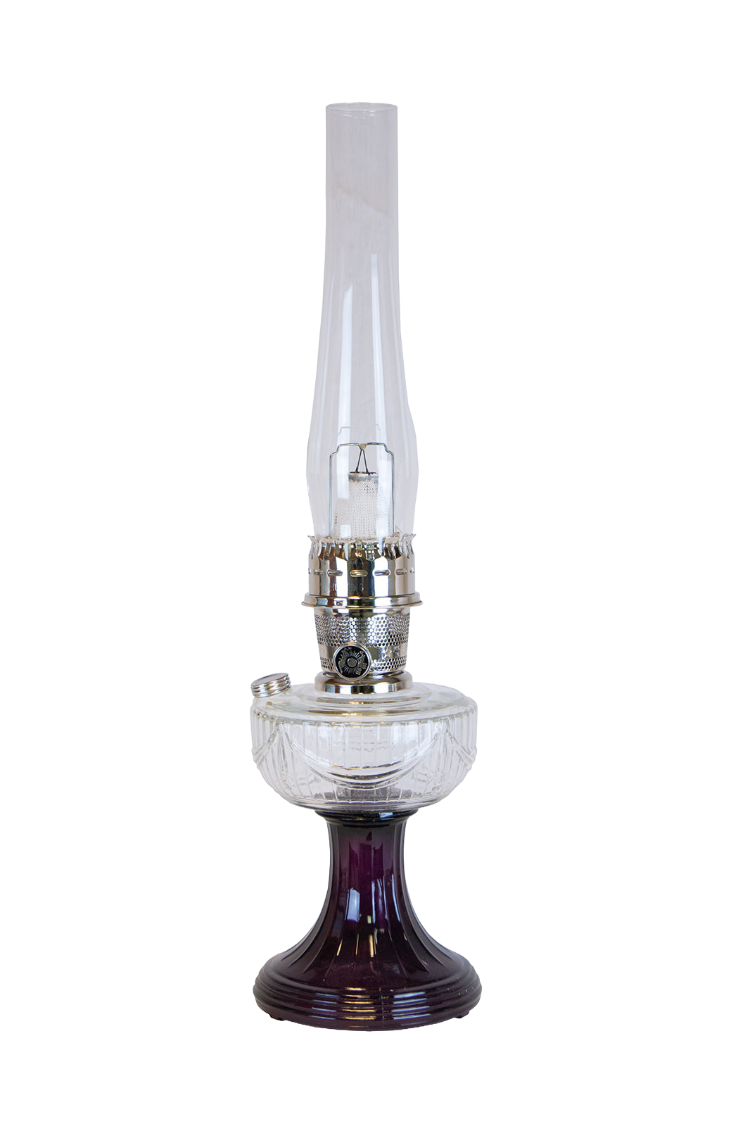 Handcrafted oil lamp featuring a clear glass font resting on an amethyst glass pedestal base with a polished metal burner and tall chimney, ideal for Lamps & Lighting and Best Sellers collections.