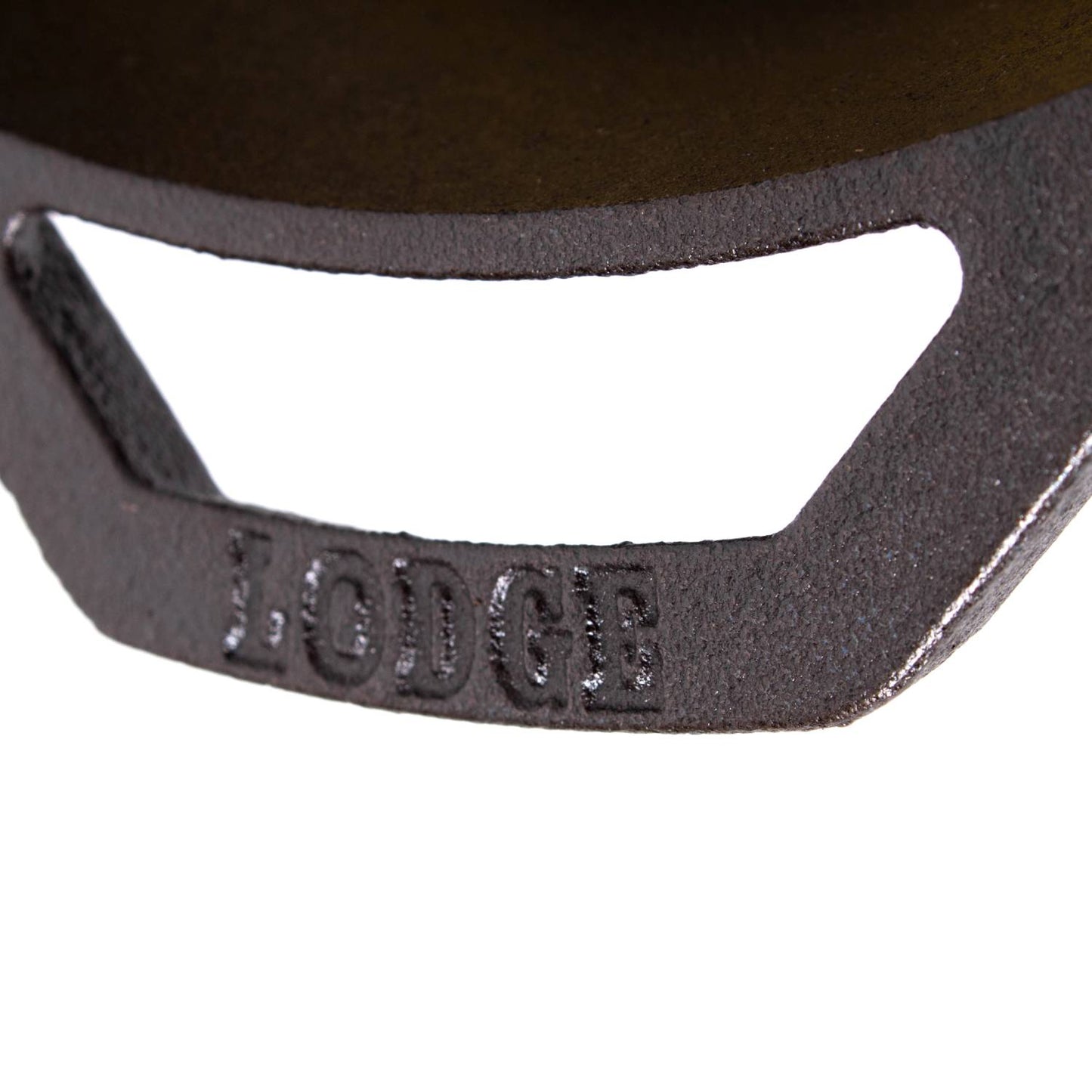 Close-up of a black cast iron skillet handle embossed with the brand name, showcasing durable construction ideal for Kitchen & Food, Cookware, Cast Iron, USA Made, and Best Sellers collections.