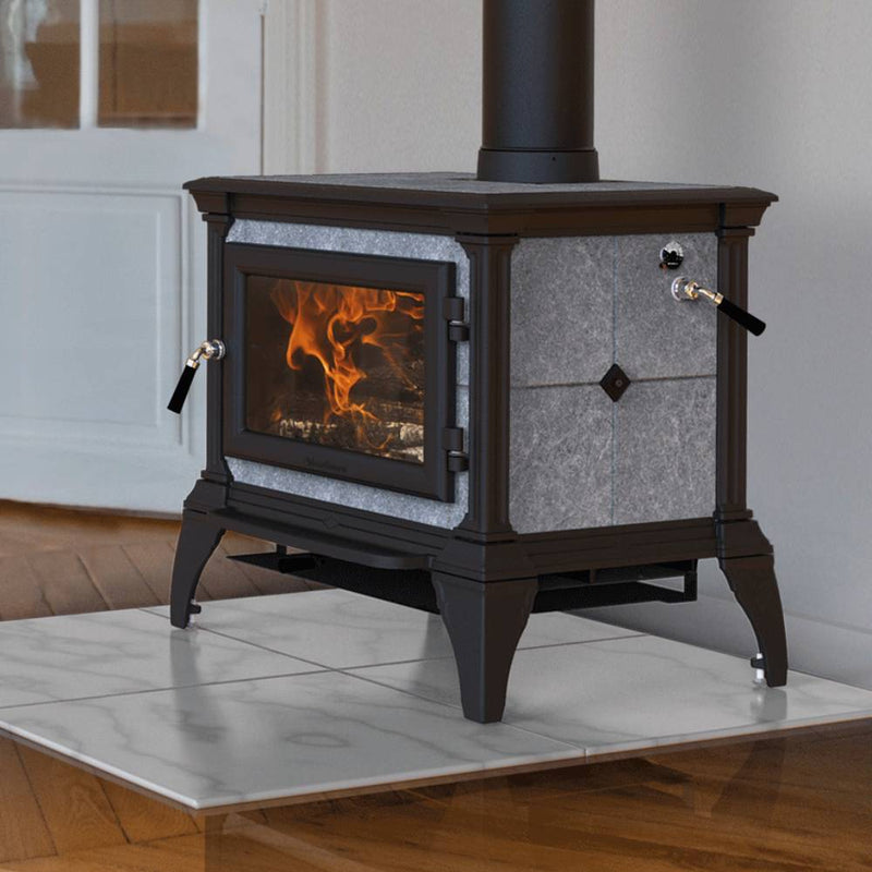 Compact Hearthstone Castleton 1 TruHybrid wood heat stove in black cast iron with soapstone panels, showing warm flames inside, featured in Stoves, Heatstoves, and Best Sellers collections.