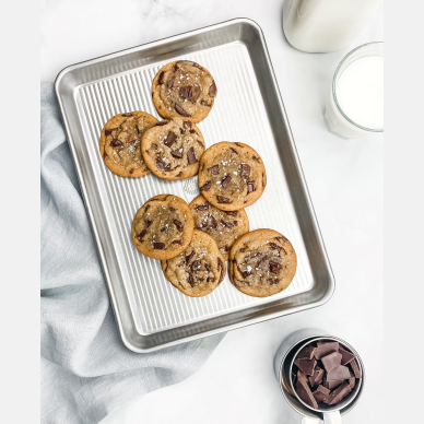 Small aluminized steel quarter sheet pan holding freshly baked chocolate chip cookies sprinkled with sea salt, featured in Kitchen & Food, Cookware, Baking Supplies, USA Made, Best Sellers, and Promo Eligible collections.