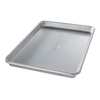 Ridged aluminized steel baking pan designed for even heat circulation, ideal for baking rolls, cookies, or roasting vegetables, featured in Kitchen & Food and Bakeware collections.