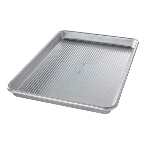 Ridged aluminized steel baking pan designed for even heat circulation, ideal for baking rolls, cookies, or roasting vegetables, featured in Kitchen & Food and Bakeware collections.