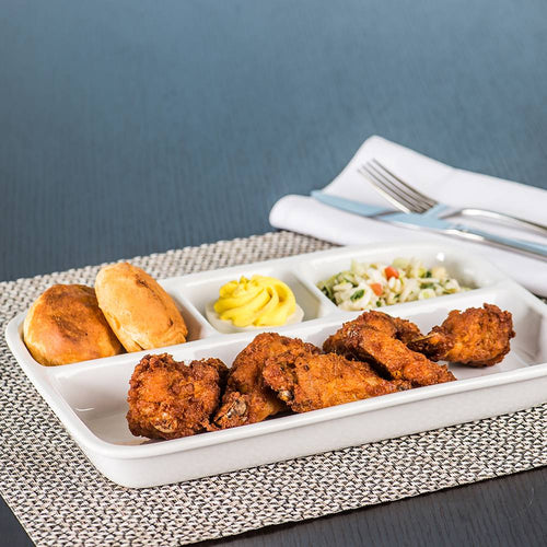Porcelain divided tray set with crispy fried chicken, two golden biscuits, mustard condiment, and a side of coleslaw, styled on woven placemat for Kitchen & Food and Dinnerware collections.