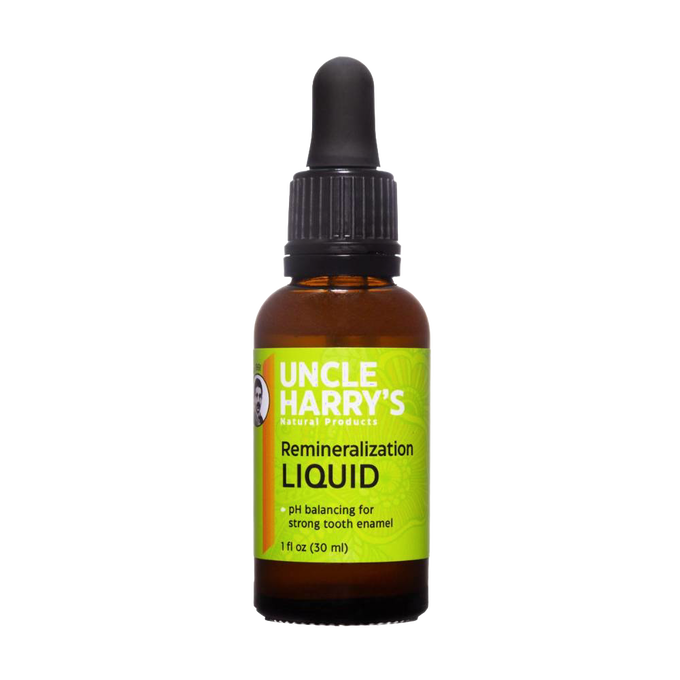 Amber glass bottle of Uncle Harry's remineralization liquid with green label and black dropper cap, promoting strong tooth enamel, USA made and vegan-friendly supplement.
