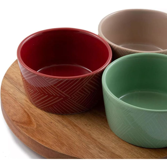 Three ceramic condiment bowls in red, beige, and green with subtle patterns on a round wooden Lazy Susan turntable, featured in Kitchen & Food, Storage and Serving, Best Sellers, Promo Eligible collections.