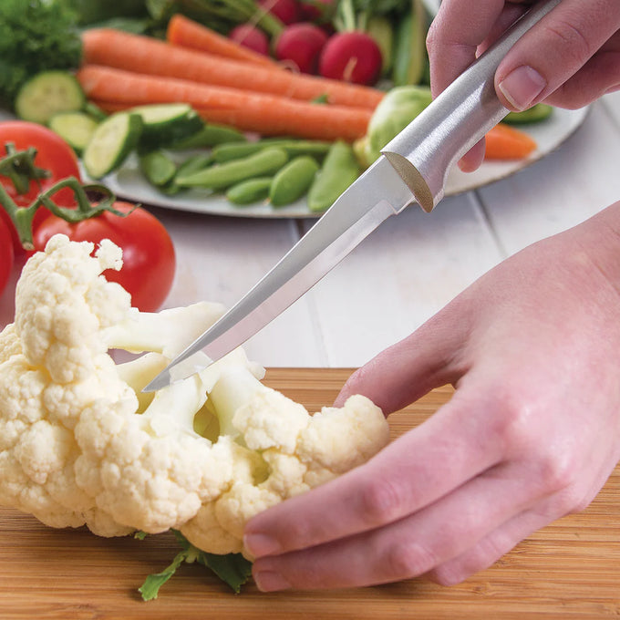 Handcrafted paring knife with a solid aluminum handle cutting fresh cauliflower on a wooden board, ideal for precise food prep in kitchen, farm, and garden tool collections.