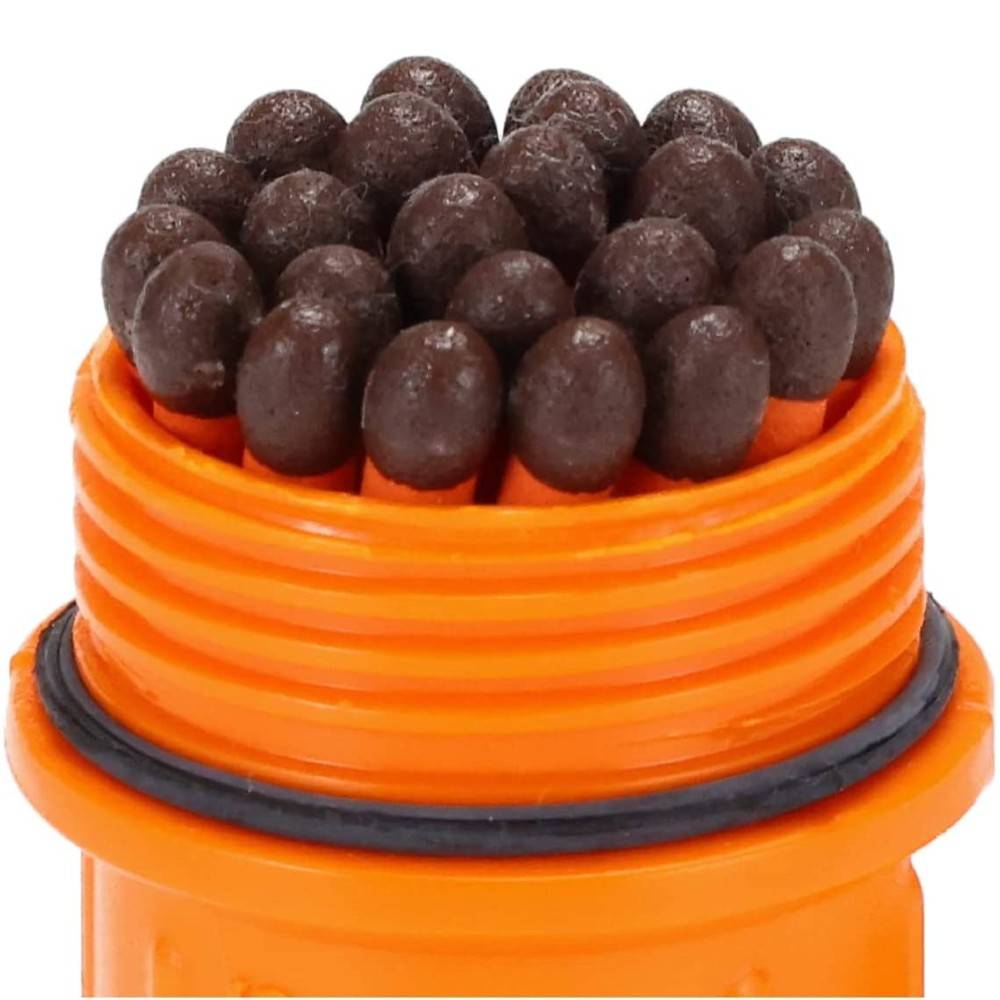 Close-up of waterproof orange container holding tightly packed dark brown weather-resistant match heads, designed for reliable outdoor use in Camping, Emergency Supplies, and Farm, Garden & Tool collections.