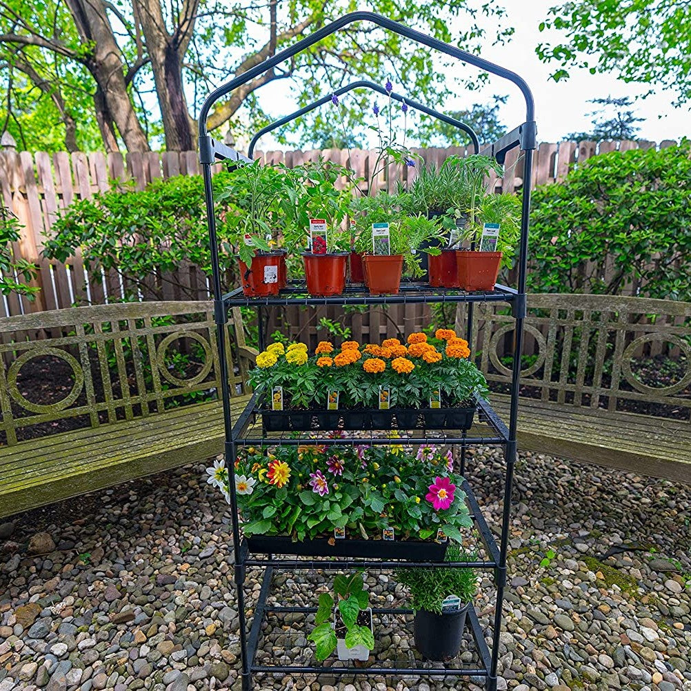 Compact greenhouse with four wire grid shelves holding various potted plants and flowers, ideal for small spaces and promoting air circulation, featured in Farm, Garden & Tool and Garden Accessories collections.