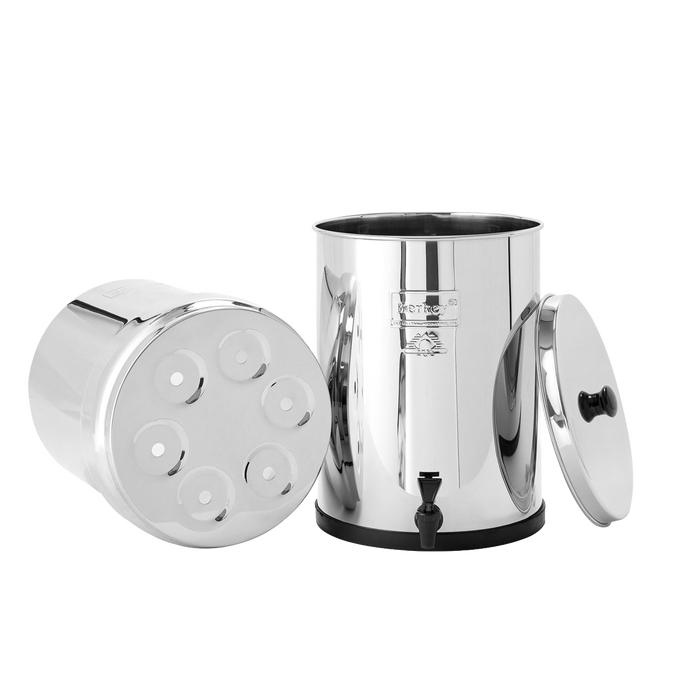 Highly polished stainless steel water filtration system with removable lid and bottom chamber featuring multiple filter element ports, part of appliances and emergency supplies collections.